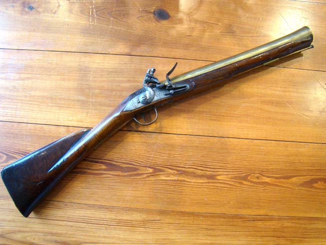 A British Navy brass barreled flintlock blunderbuss by James Farmer dated 1744